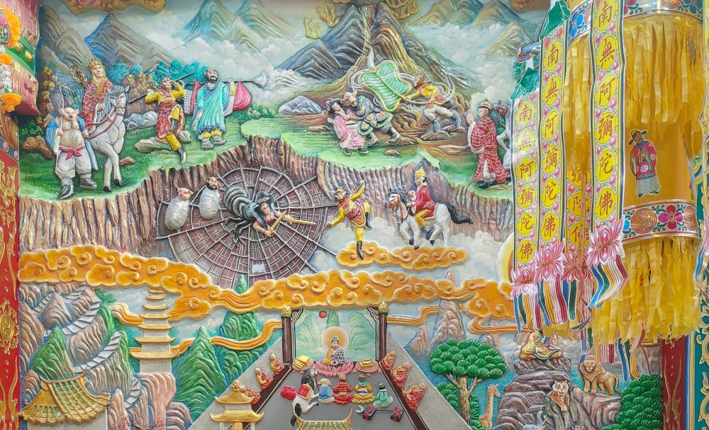 A mural with humanoid monkeys doing various things like meditating and riding on yellow clouds